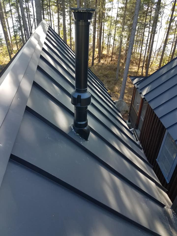 Close up of black seam metal roofing on roof