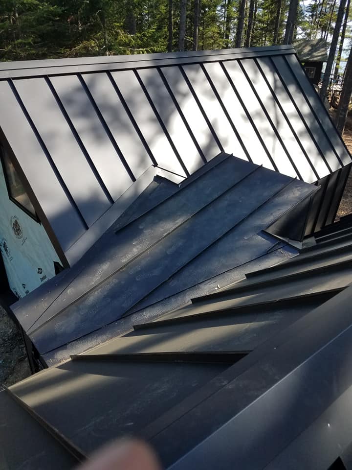 Close up of black seam metal roofing from roof angle